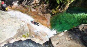 Canyoning down a Costa Verde waterfall, near the campsite in Corsica